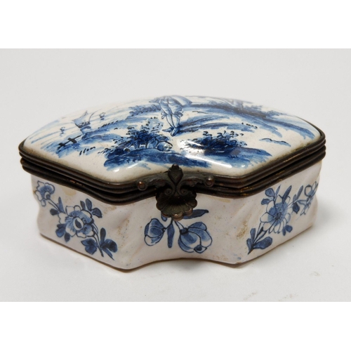 208 - A Delft porcelain miniature box of curved form painted landscape, 7.5cm wide