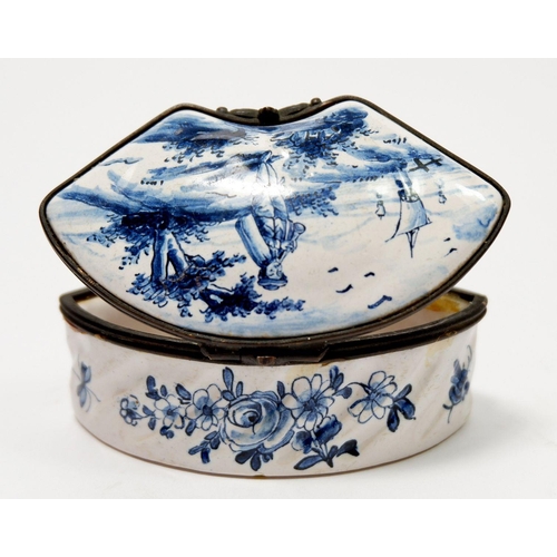 208 - A Delft porcelain miniature box of curved form painted landscape, 7.5cm wide