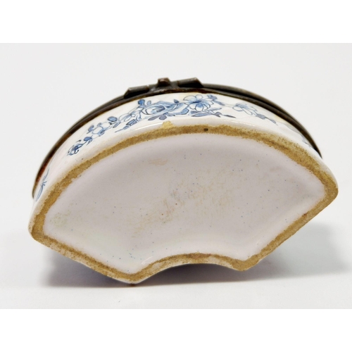 208 - A Delft porcelain miniature box of curved form painted landscape, 7.5cm wide