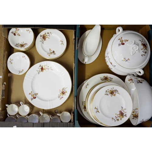 213 - A Royal Worcester Golden Harvest dinner service comprising: eight dinner plates, gravy jug and dish,... 