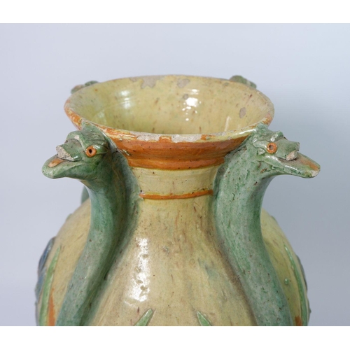 27 - An Arts & Crafts pottery vase decorated flowers with stylised bird heads to rim, monogramed MLI, 37c... 