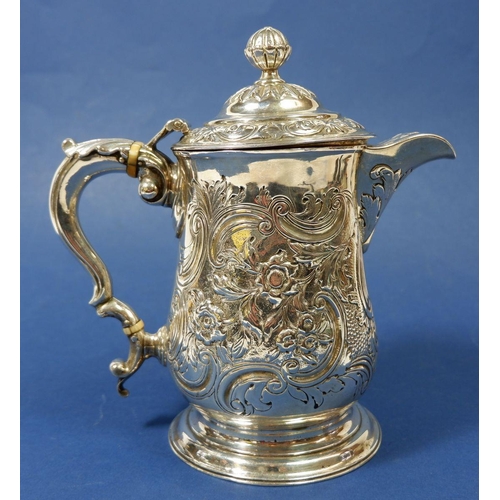 417 - A George II silver flagon with later embossed decoration, 21cm tall, London 1771 by John King, 730g