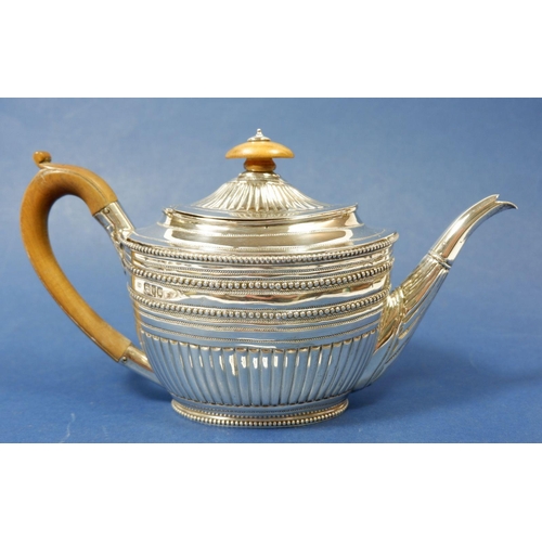 421 - A Victorian silver half reeded and beaded teapot with fruitwood finial and handle, 543g, London 1890... 