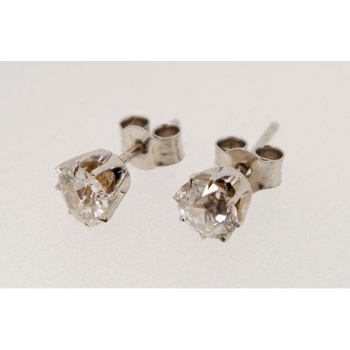 431 - A pair of platinum set diamond stud earrings - approx 1ct total, for pierced ears