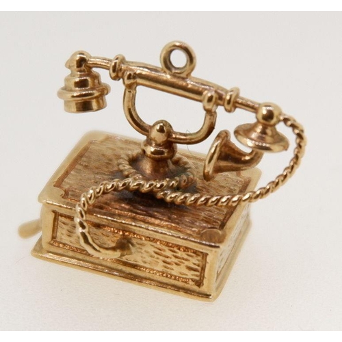 433 - A 9 carat gold telephone charm, 6g