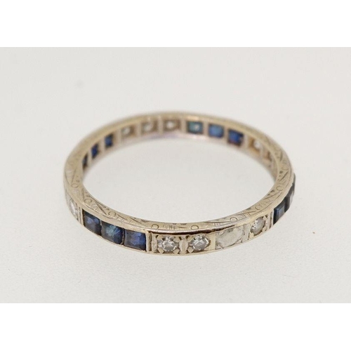 440 - A platinum eternity ring set sapphires & diamonds, size P-Q 2.6g