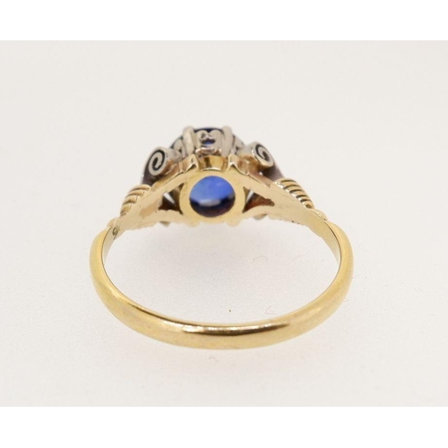 446 - A single stone sapphire ring of good colour, approx 1.5cts, in yellow and white gold scroll setting,... 