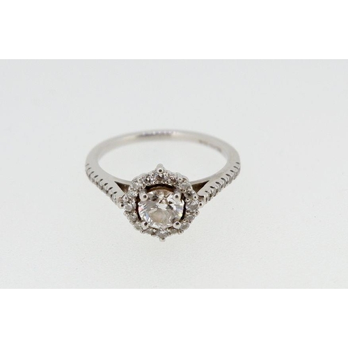 447 - A fine platinum set modern diamond cluster ring, the brilliant cut central stone within diamond surr... 