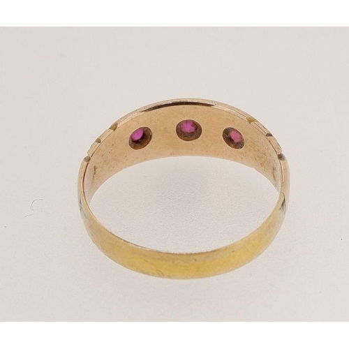 449 - A Victorian 22 carat gold ring set three rubies, size O, 3g