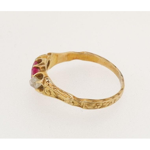 452 - A Victorian gold ring set ruby flanked by two old cut diamonds, size N, 2.3g