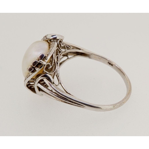 453 - An 18 carat white gold large pearl ring with six baguette and twenty four small eight cut diamonds, ... 