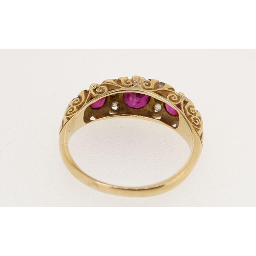 461 - A Victorian 18 carat gold ruby and diamond ring the three rubies interspersed with eight old cut dia... 