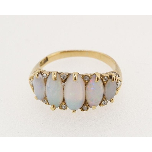 462 - A Victorian gold five stone opal ring interspersed with small diamonds, size M to N, 5g