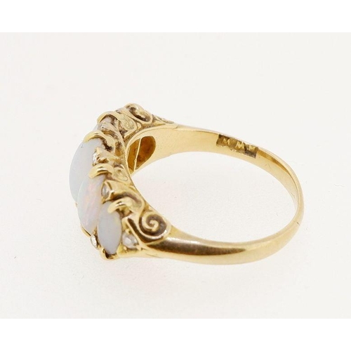 462 - A Victorian gold five stone opal ring interspersed with small diamonds, size M to N, 5g