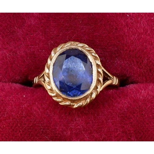 469 - A 9 carat gold ring set oval cut blue stone, size J to K, 3.2g