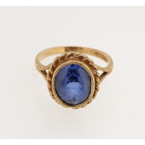 469 - A 9 carat gold ring set oval cut blue stone, size J to K, 3.2g