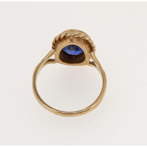 469 - A 9 carat gold ring set oval cut blue stone, size J to K, 3.2g