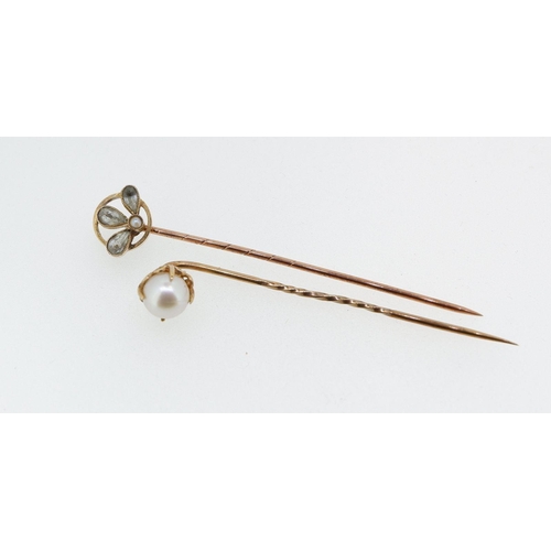 485 - An Edwardian gold stick pin set citrines and seed pearl in original box and a yellow metal and pearl... 