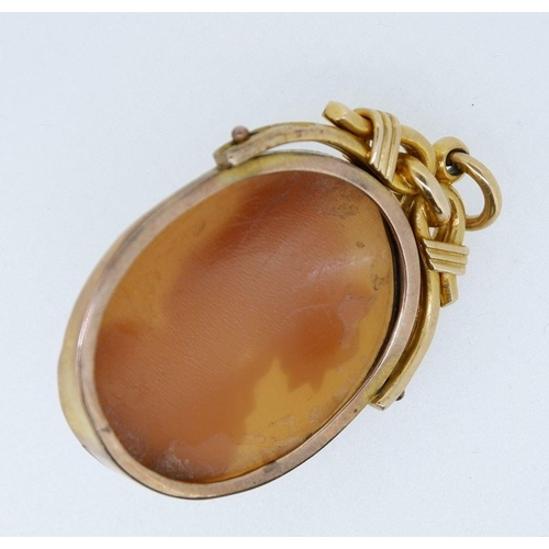 494 - An 18 carat gold mounted antique cameo pendant, 3.4cm long