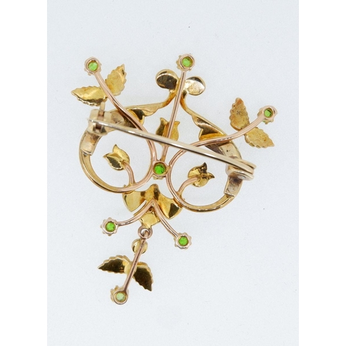 495 - An Edwardian 15 carat gold openwork brooch set seed pearls and green stones in original case, 3.5 x ... 