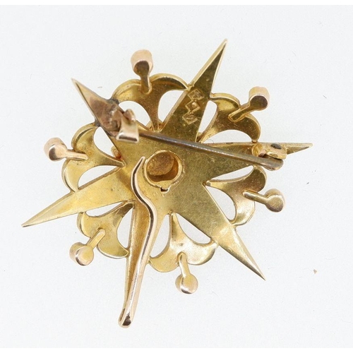 502 - An Edwardian 15 carat gold pearl set star form brooch or pendant set six diamond points, 7.4g, 3.5cm... 