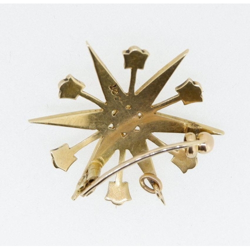 514 - An Edwardian 15 carat gold pearl set star form brooch, 3cm diameter, 4.4g