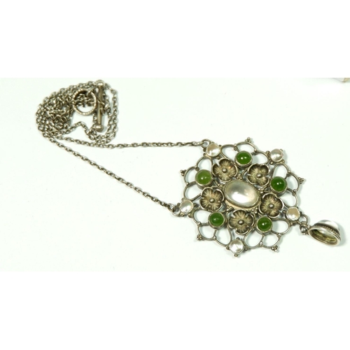 533 - A white metal Arts & Crafts pendant set moonstone, pearls and green stone, 8.2g