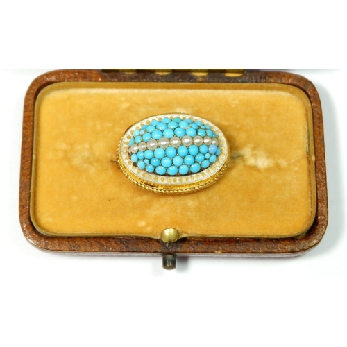 536 - A Victorian yellow metal oval domed brooch set turquoise and seed pearls, 2.5cm wide, boxed