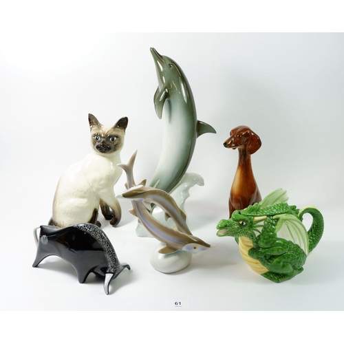 61 - A group of animal ornaments to include Beswick cat, dolphin, Hungarian sturgeon, Italian bull and a ... 