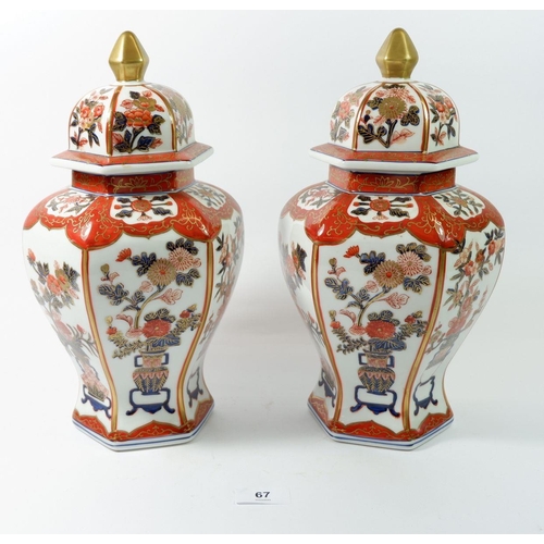 67 - A pair of Imari style hexagonal jars and covers, 32cm high