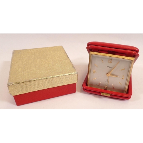 771 - An Imhof red leather cased travel alarm clock, boxed with receipt