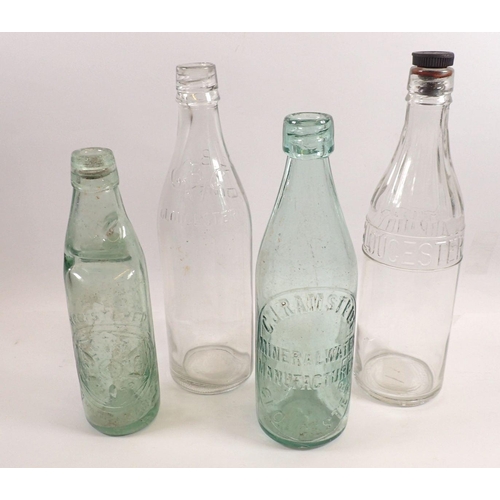 789 - Four glass bottles relating to Gloucester