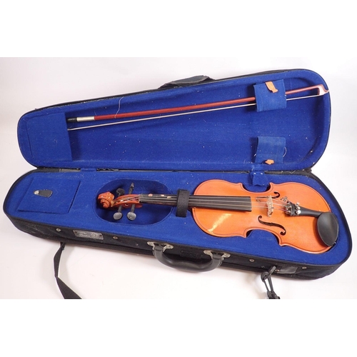 791 - A Chinese 1/8 size violin, cased with bow