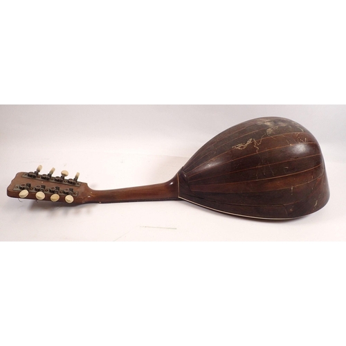 794 - A 19th century American eight string mandolin, bone pegs and inlay, labelled inside Regal MFG Co Wol... 