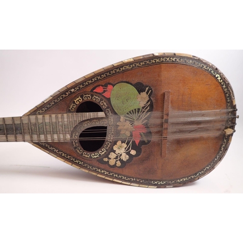 795 - A 19th century twelve string mandolin with a mother of pearl and abalone fingerboard, fluted rosewoo... 