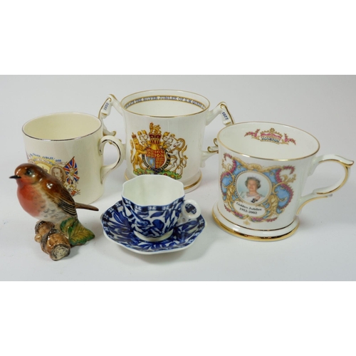 81 - A Beswick robin, three commemorative items and a miniature Coalport blue and white cup