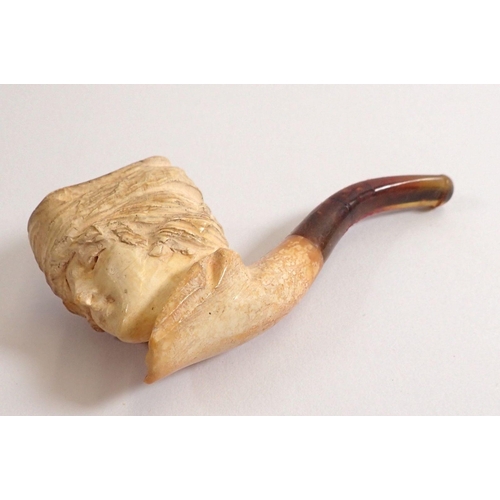 813 - A 19th century meerchaum pipe in the form of a ladies head, 9cm long in case