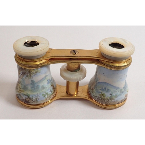 816 - A pair of late 19th century enamelled opera glasses decorated rococo landscape scenes with mother of... 