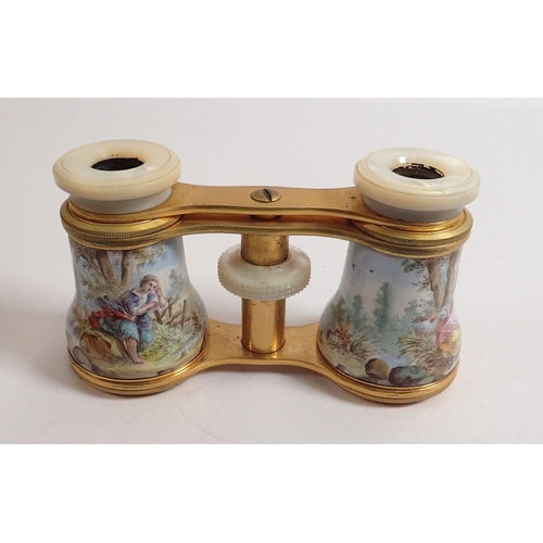 816 - A pair of late 19th century enamelled opera glasses decorated rococo landscape scenes with mother of... 