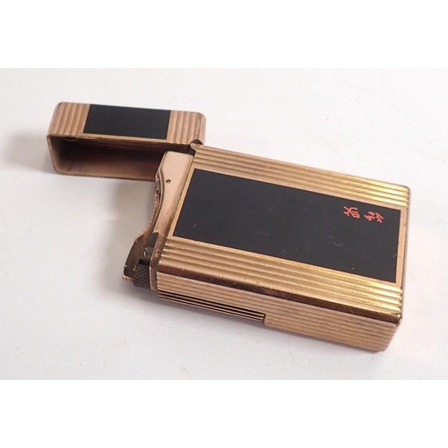 819 - A Dupont gold plated lighter with Chinese script