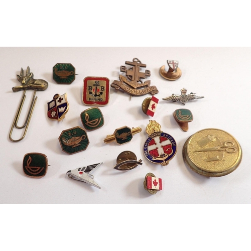 827 - A box of badges and an RAF silver brooch