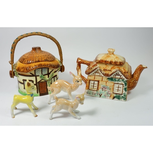 83 - A Babycham deer, two other deer and a cottage ware teapot and biscuit barrel