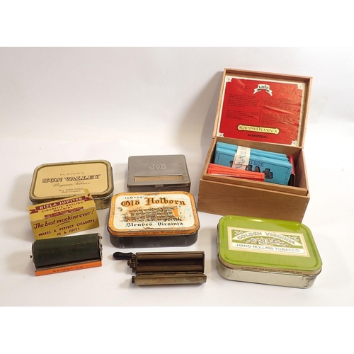 847 - A brass 'The Climax' cigarette roller, a box of Rizla papers and another roller