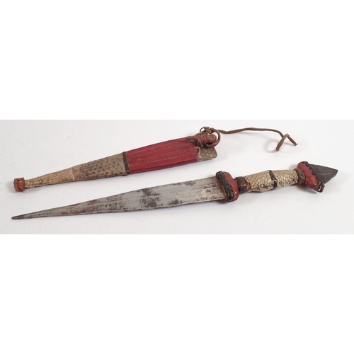 873 - A Nigerian Hausa metal bladed knife with snakeskin and leather clad handle and scabbard, 26cm total ... 