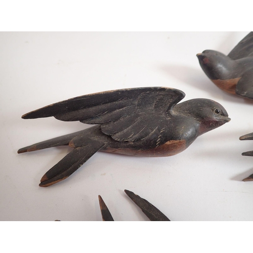 900 - A group of Black Forrest carved and painted swallows