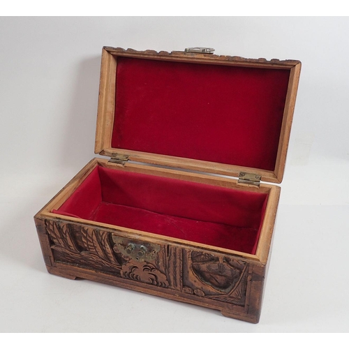 909 - A miniature carved camphor wood box, 25cm wide