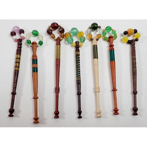 925 - A collection of fifteen inlaid wire bobbins