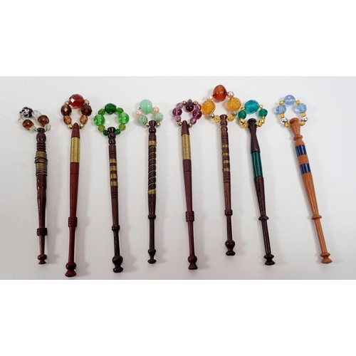 925 - A collection of fifteen inlaid wire bobbins