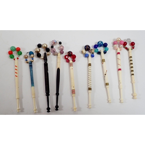 926 - A collection of nineteen antique bone bobbins with wire inlay and painted decoration