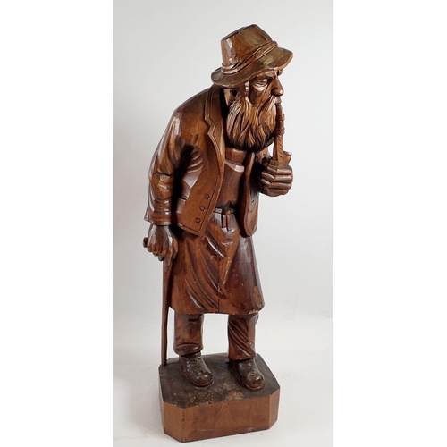 968 - A Black Forrest large carved figure of an old man with pipe, 52cm